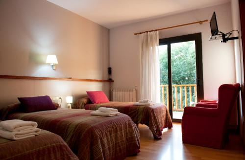 Giường trong phòng chung tại Hotel Seva