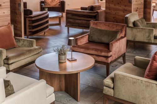 a room with chairs and tables in a store at NIDUM - Casual Luxury Hotel in Seefeld in Tirol