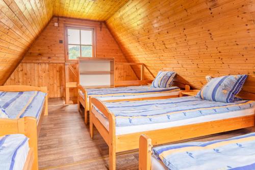 Postel nebo postele na pokoji v ubytování CEJCH - rekreační areál s restaurací