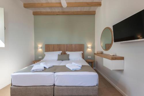 Кровать или кровати в номере AnamneZia Luxury Suites