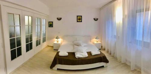 Un pat sau paturi într-o cameră la Hotel Green House