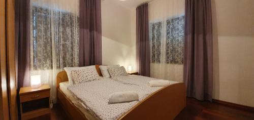 Postel nebo postele na pokoji v ubytování Apartments Golub
