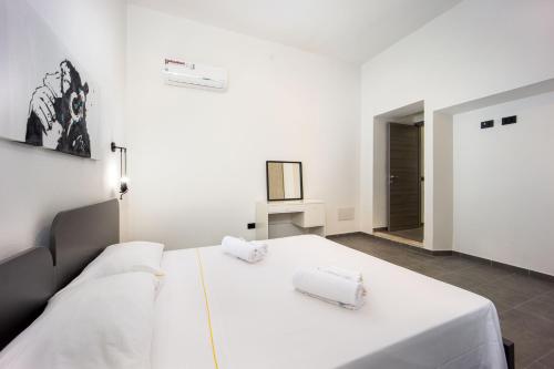Posteľ alebo postele v izbe v ubytovaní Coru e Mari 2 Apartments