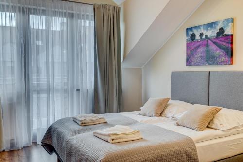 Postel nebo postele na pokoji v ubytování Apartamenty Zdrojowa