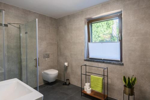 Ванная комната в Ostsee Elmenhorst Sehr hochwertige Dreizimmer Ferienwohnung mit Gartenterrasse