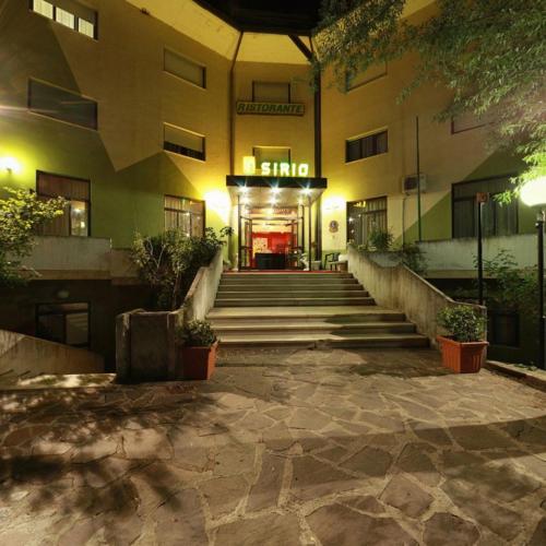 a building with stairs in front of a building at HOTEL SIRIO in Villa D'agri