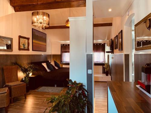 a living room with a couch and a table at B&B Prachtig Allemachtig in Valkenburg