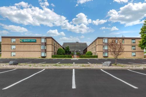 an empty parking lot in front of a building at Quality Inn & Conference Centre in Midland