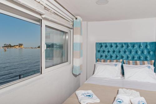 Postel nebo postele na pokoji v ubytování Denise Beach Hotel