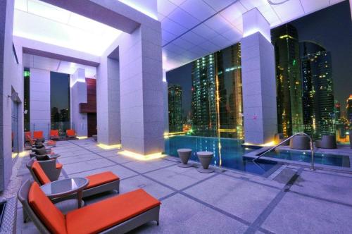 a building with a view of a city skyline at Royal Club By RVHR, Bonnington Residential Tower - JLT in Dubai