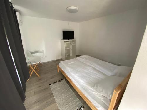 Ένα ή περισσότερα κρεβάτια σε δωμάτιο στο Pixel Guesthouse