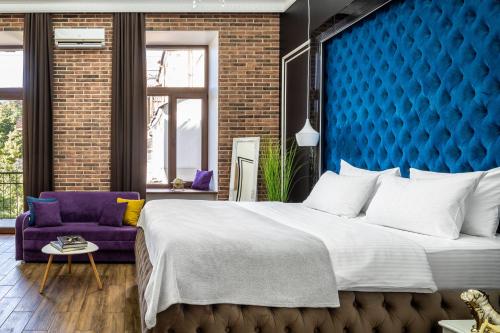 Letto o letti in una camera di Theatre Boutique Apartments