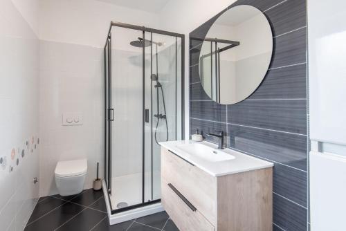 a bathroom with a shower and a sink and a mirror at Apartman Justina Medulin for 2 person in Medulin