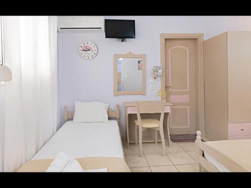Ένα ή περισσότερα κρεβάτια σε δωμάτιο στο Villa Rania