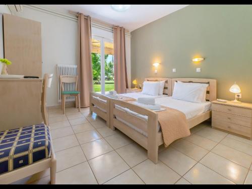 Ένα ή περισσότερα κρεβάτια σε δωμάτιο στο Villa Rania