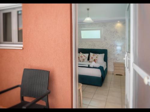 Ένα ή περισσότερα κρεβάτια σε δωμάτιο στο Villa Rania