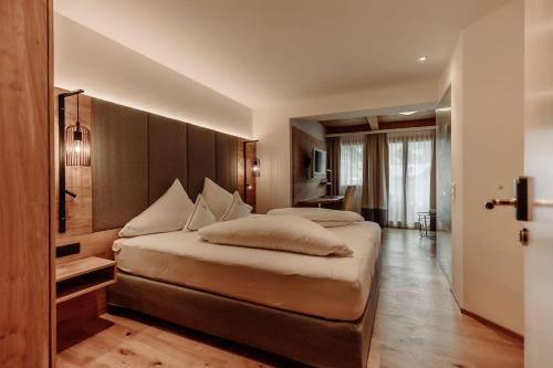 a bedroom with two beds in a room at Ferienwohnungen Renberg in Maria Alm am Steinernen Meer