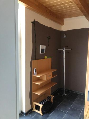 a room with a book shelf and a lamp at FeWo Rehbach in Leipzig