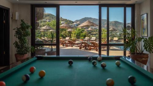 a pool table with balls on it in a room at 4reasons hotel + bistro | 12+ in Yalıkavak