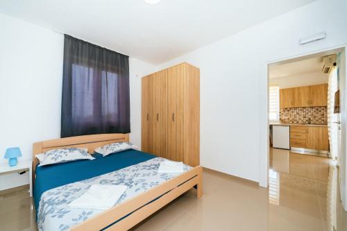 Giường trong phòng chung tại Apartments Nahla