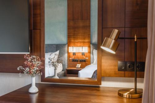 Postel nebo postele na pokoji v ubytování ATECA Hotel Suites Tashkent