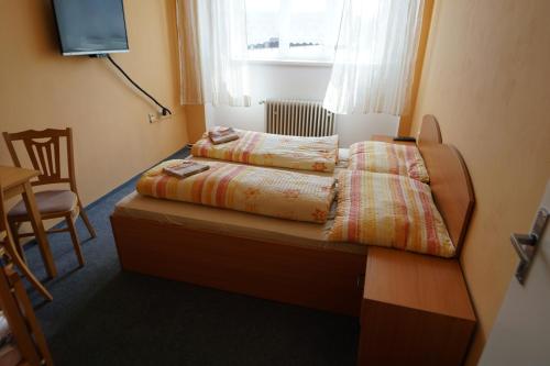 Postel nebo postele na pokoji v ubytování Penzion Hamr