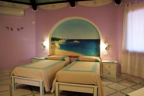 Een bed of bedden in een kamer bij Residence Riva Azzurra