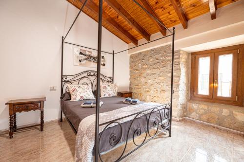 a bedroom with a bed with a metal canopy at C,AN ARTUR in Binissalem