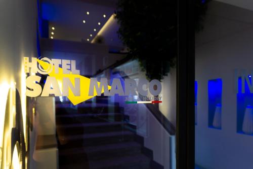 a view of a staircase in a building with blue lights at Hotel San Marco in Reggio Emilia