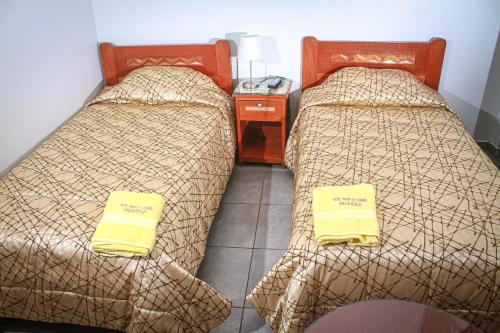 Un ou plusieurs lits dans un hébergement de l'établissement Hotel Virgen del Carmen - Huaraz