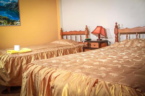 Un ou plusieurs lits dans un hébergement de l'établissement Hotel Virgen del Carmen - Huaraz