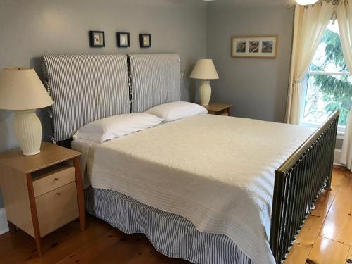 A bed or beds in a room at In Wolfville Accommodations