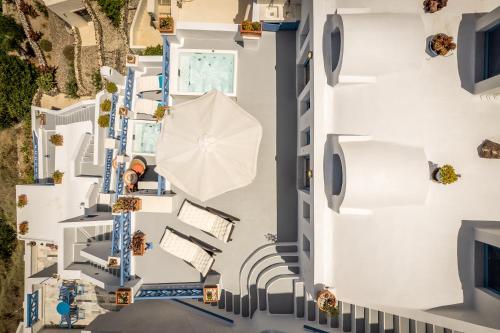 an overhead view of a building with an umbrella at Golden Grey Goose in Fira