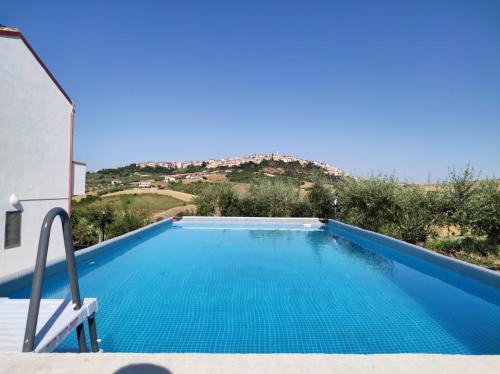 a swimming pool with a view of a mountain at B&B Pozzo Innamorato in Montenero di Bisaccia