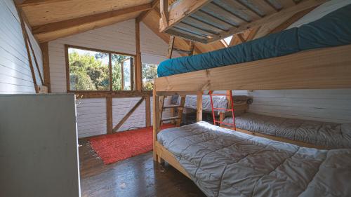 Двухъярусная кровать или двухъярусные кровати в номере Hostal Climb House