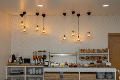 a kitchen with many lights hanging from the wall at LOBOS VILLAGE - Alojamento in Seia