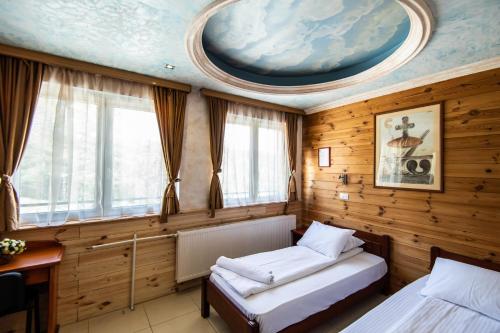 Postel nebo postele na pokoji v ubytování Hotel Enigma