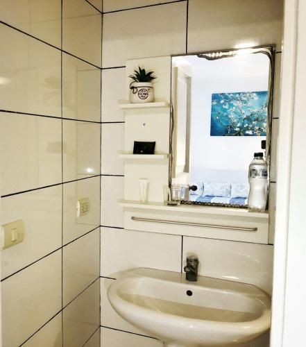 a bathroom with a sink and a window at Caribbean and sun Punta Cana in Punta Cana