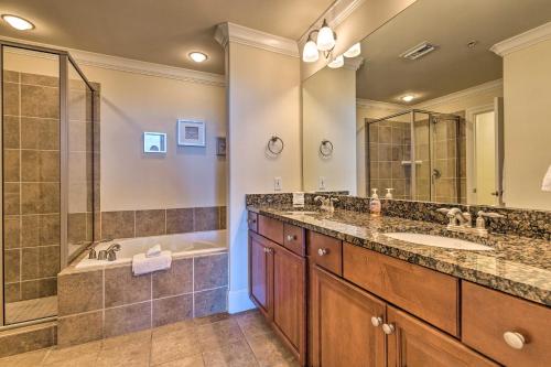 a bathroom with two sinks and a shower at Dauphin Island Condo with Pool, Balcony and Ocean View in Dauphin Island
