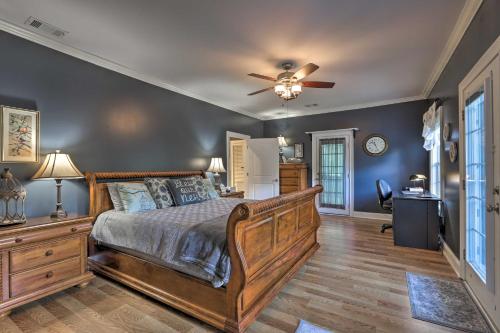 a bedroom with a bed and a ceiling fan at Picturesque Abode with Dock on Jackson Lake! in Jackson