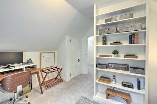 a room with a desk and a computer on a shelf at Charming Jaffrey Cottage with Deck and Grill! in Jaffrey
