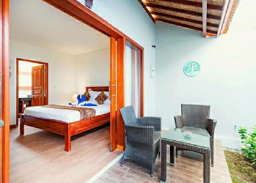 Hotel and Villa B52 Gili Airにあるベッド