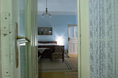 a view of a room with a table and a chair at Kuća za odmor Weinrauch in Ilok