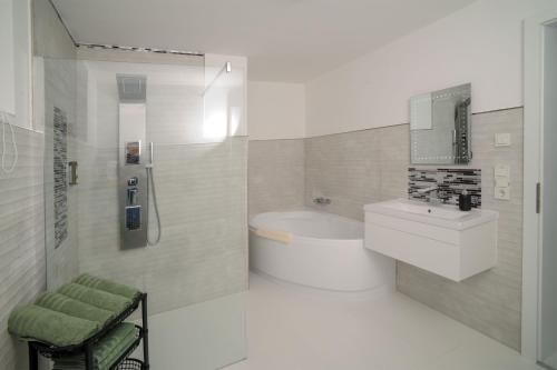 a bathroom with a toilet and a sink and a shower at Designapartments Die besondere ART - Sennhütte 7 in Wernigerode