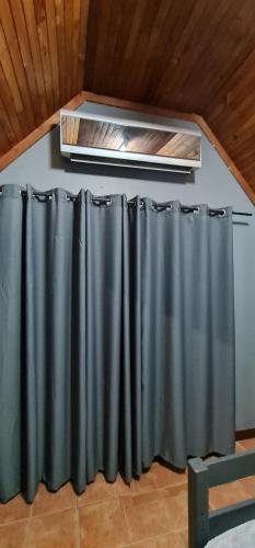 a room with black curtains on a wall at Sleepover @194 in Rustenburg