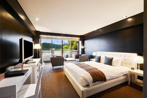 Ein Bett oder Betten in einem Zimmer der Unterkunft Relax Resort Hotel