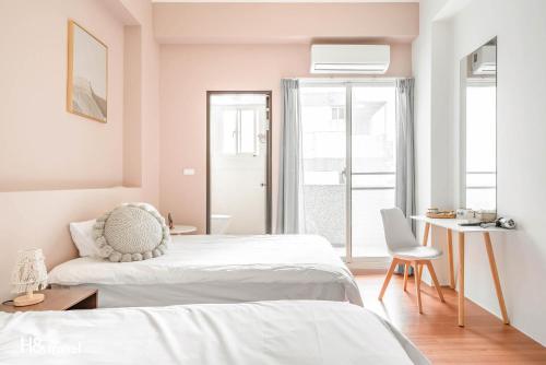 Postel nebo postele na pokoji v ubytování Taitung Puyuma Style Inn