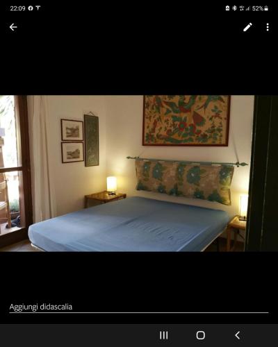 Postel nebo postele na pokoji v ubytování Domus La Pineta