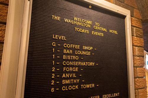 a menu on the wall of a restaurant at Washington Central Hotel and Sleepwell Inn in Workington