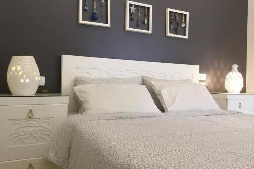 Postel nebo postele na pokoji v ubytování Beyt Alzohour - Casa dei Fiori
